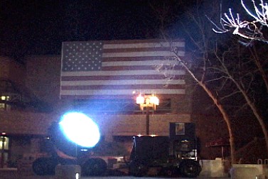 Searchlight rental lighting a giant American flag at a special event